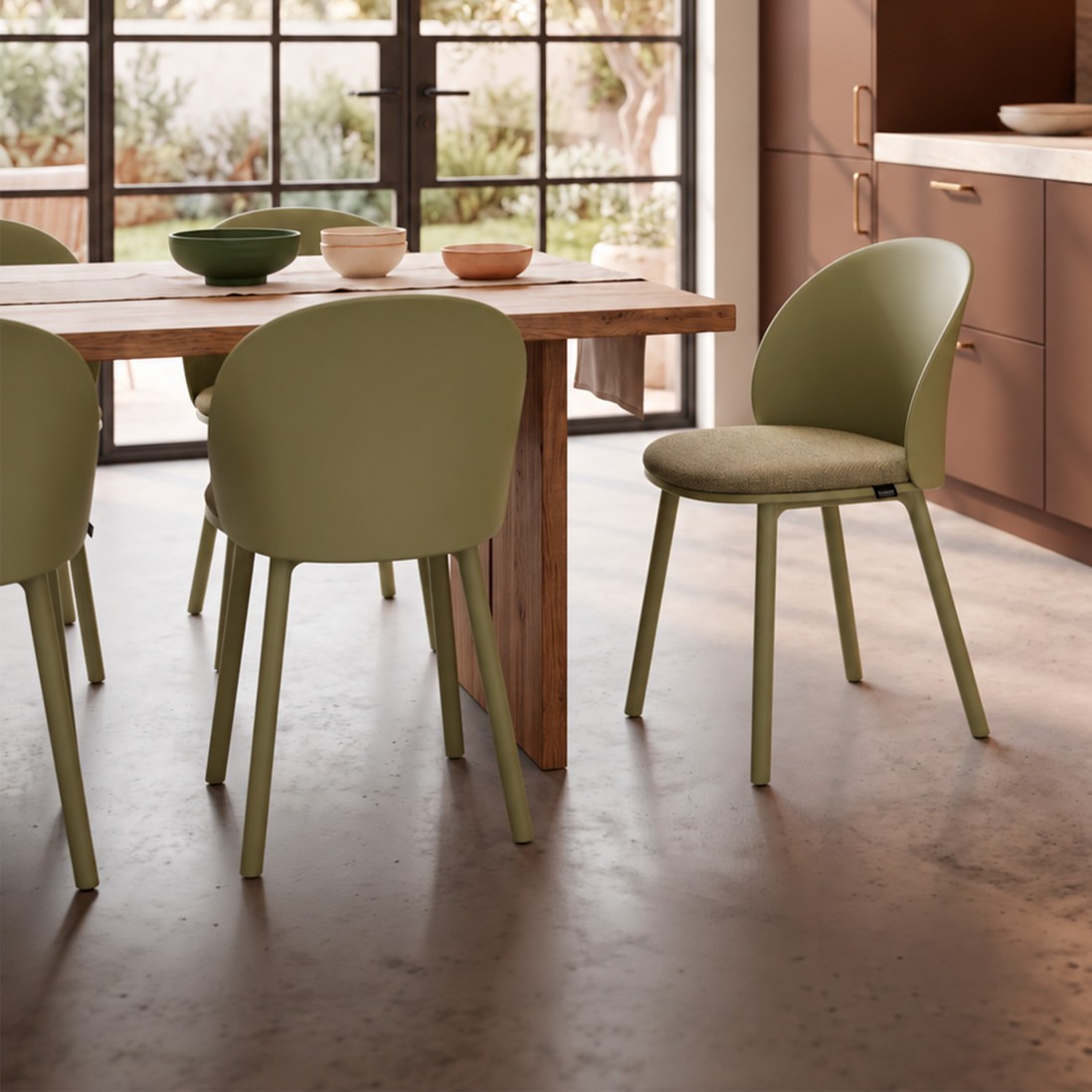 Stella green polypropylene chair with cushioned seat